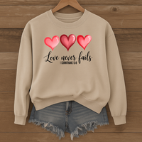 Load image into Gallery viewer, Love Never Fails Christian Sweatshirt, Faith Based Valentine Gift Crewneck, 3 Heart Design, Corinthians 13:8