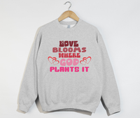 Load image into Gallery viewer, Love Blooms Where God Plants It - Sweatshirt
