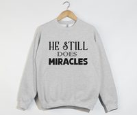 Load image into Gallery viewer, He Still Does Miracles - Christian Sweatshirt
