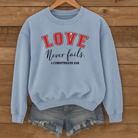Load image into Gallery viewer, Love Never Fails Unisex Sweatshirt