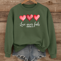 Load image into Gallery viewer, Love Never Fails Christian Sweatshirt, Faith Based Valentine Gift Crewneck, 3 Heart Design, Corinthians 13:8