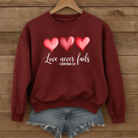 Load image into Gallery viewer, Love Never Fails Christian Sweatshirt, Faith Based Valentine Gift Crewneck, 3 Heart Design, Corinthians 13:8