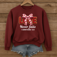 Load image into Gallery viewer, Love Never Fails Christian Sweatshirt, Faith Based Women's Valentine Gift, Yarn Bow Coquette Design, Corinthians 13:8