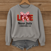 Load image into Gallery viewer, Love Never Fails Christian Sweatshirt, Faith Based Women's Valentine Gift, Yarn Bow Coquette Design, Corinthians 13:8