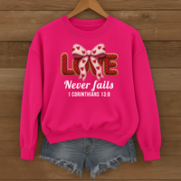 Load image into Gallery viewer, Love Never Fails Christian Sweatshirt, Faith Based Women's Valentine Gift, Yarn Bow Coquette Design, Corinthians 13:8