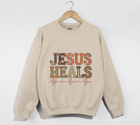 Load image into Gallery viewer, Jesus Heals The Brokenhearted - Sweatshirt
