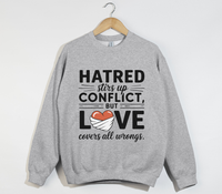 Load image into Gallery viewer, Hatred Stirs Up Conflict, But Love Covers All Wrongs - Sweatshirt
