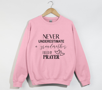 Load image into Gallery viewer, Never Underestimate A Grandmother Fueled By Prayer - Sweatshirt

