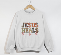 Load image into Gallery viewer, Jesus Heals The Brokenhearted - Sweatshirt
